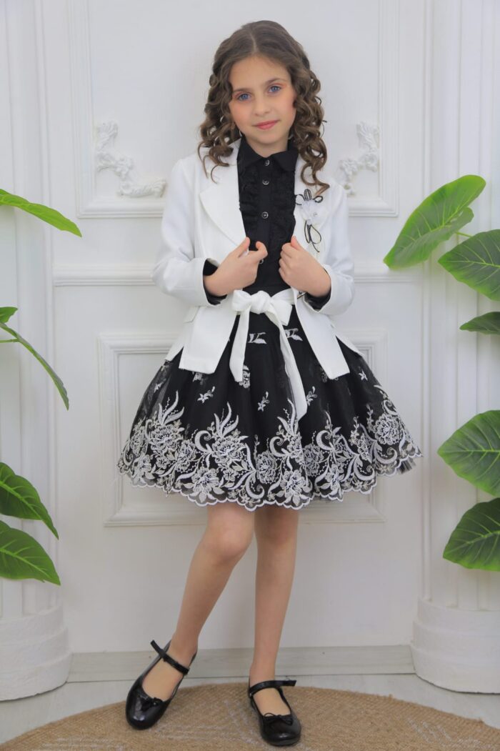 Kit . Four-piece skirt, jacket, brooch and shawl